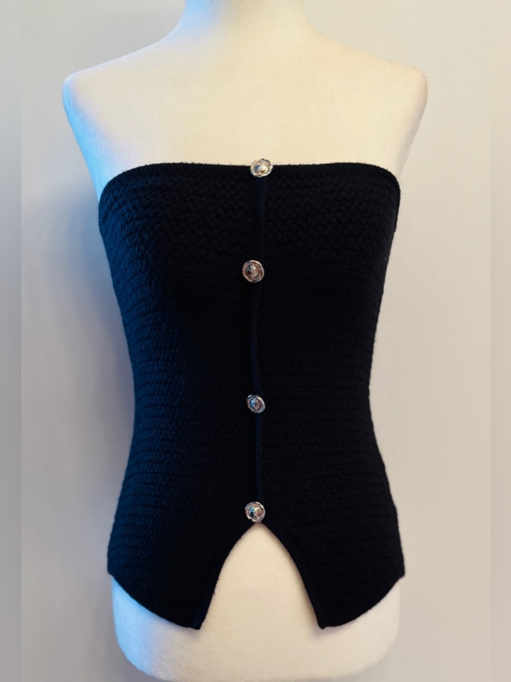 Knit strapless bustier featuring silver-toned buttons & a center front slit. S